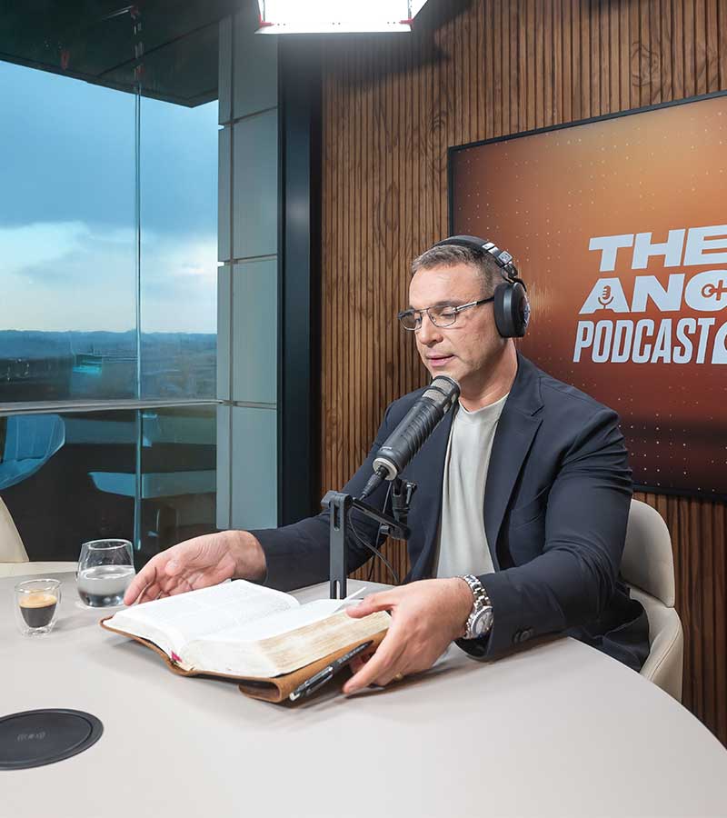 Amir Tsarfati reading the Bible at the Anchor Podcast microphone