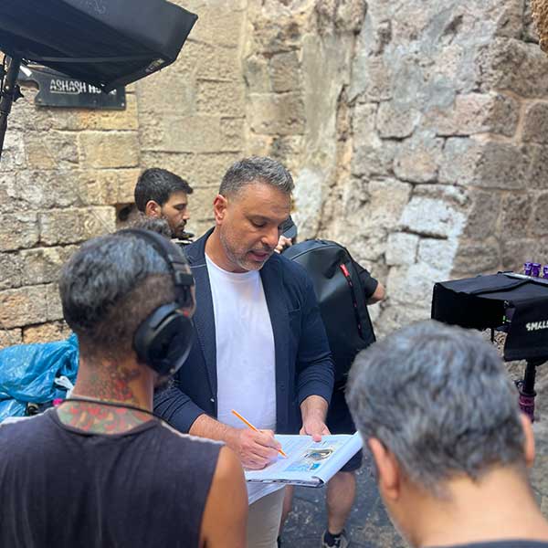 Amir Tsarfati on location at ancient stone walls in Israel